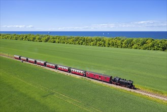 Molli steam locomotive on the narrow-gauge railway running along the Baltic Sea between Bad Doberan