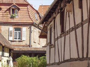 Traditional half-timbered houses with wooden beams and old windows in a historic neighbourhood,