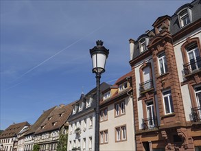 A street view with historic buildings and an old lantern, Wissembourg, Alsace, France, Europe