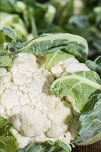 Portion of fresh Cauliflower on wooden background