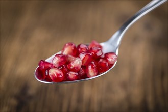 Portion of Pomegranate seeds (close-up shot, selective focus)