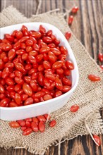 Some fresh Goji Berries (also known as Wolfberry) on vintage wooden background