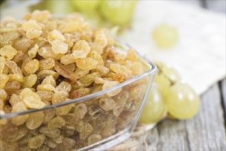 Heap of Raisins with fresh fruits (close-up shot)