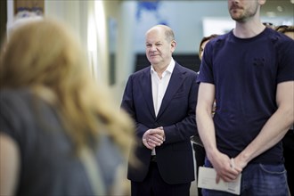 Olaf Scholz, Federal Chancellor (SPD), joins the queue to cast his vote for the European elections