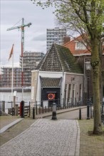 Building front of a city with a crane and construction work in the background, Dordrecht, holland,