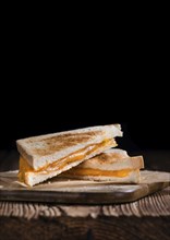 Fresh made Cheese Sandwich (selective focus) on an old wooden table