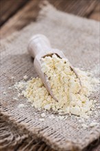 Heap of Chick Pea flour on an old wooden table