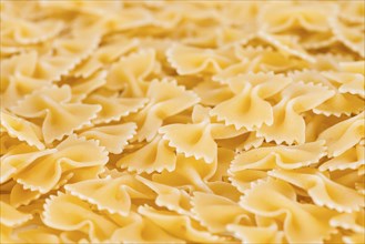 Raw Farfalle (also known as Bow-Tie Pasta) close-up shot for use as background image or as texture