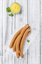 Wiener Sausages on a vintage background as detailed close-up shot (selective focus)