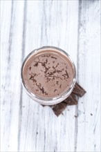 Fresh made Chocolate Milk on a bright wooden background