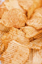 Portion of rippled Potato Chips for use as background image or as texture