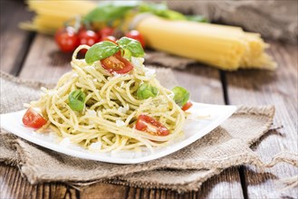 Fresh made Spaghetti (with Pesto Sauce, Parmesan Cheese and Tomatoes)