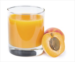 Fresh made Apricot Juice isolated on white background (close-up shot)