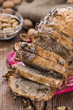 Fresh made Walnut Bread (detailed close-up shot) on wooden background