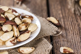 Some Brazil Nuts on vintage wooden background