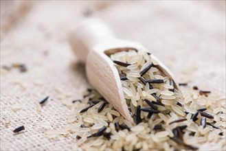 Uncooked Rice (mixed with wild Rice) on rustic background