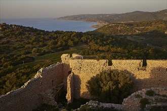 View from a stone ruin of the coastal landscape at sunset, Kritinia Castle, St John's Castle,