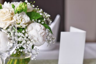 Close up of white flower bouquet at wedding table