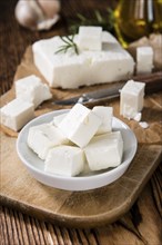 Feta Cheese (on wooden background) as detailed close-up shot