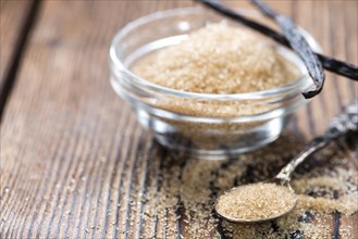 Portion of homemade Brown Vanilla Sugar (close-up shot)