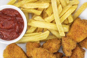 Homemade Chicken Nuggets on vintage background (selective focus, close-up shot)