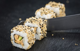 Fresh made Sushi (selective focus) on a vintage looking slate slab