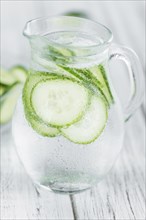 Cucumber Water on a vintage background as detailed close-up shot, selective focus