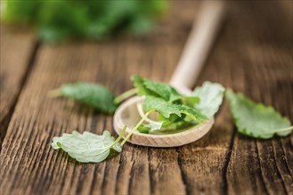 Balm on rustic wooden background (close-up shot)