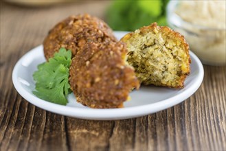 Falafel (close-up shot, selective focus) on an old wooden table