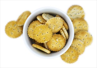 Portion of mixed Snacks isolated on white background (close up shot, selective focus)