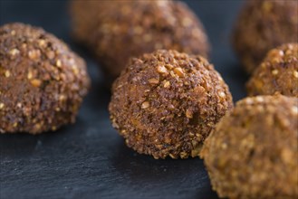 Falafel (close-up shot, selective focus) on an old wooden table