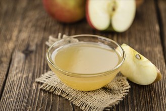 Portion of Applesauce (selective focus) on vintage background (close-up shot)