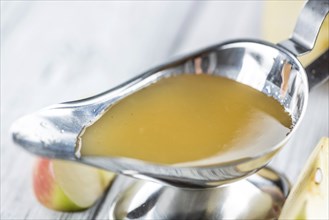 Portion of Applesauce (selective focus) on vintage background (close-up shot)