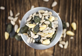 Heap of mixed Seeds (close-up shot) on wooden background