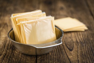 Portion of sliced Cheese (close-up shot, selective focus)