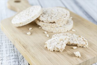 Old wooden table with Rice Cakes (detailed close-up shot)