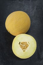 Honeydew Melon on a vintage background as detailed close-up shot (selective focus)