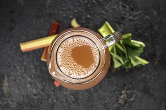 Portion of fresh made Rhubarb Juice (close up shot, selective focus)