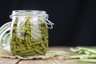 Portion of preserved Green Beans as detailed close-up shot (selective focus)