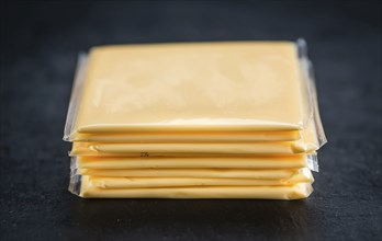 Portion of sliced Cheese (close-up shot, selective focus)