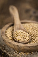 Seeds (Mustard) as high detailed close-up shot on a vintage wooden table (selective focus)