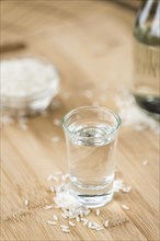 Japanese Sake drink on an old wooden table (close-up shot)