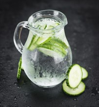 Some fresh Cucumber Water on a vintage slate slab, selective focus, close-up shot