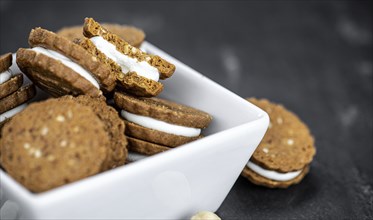 Hazelnut Cream Cookies as detailed close up shot (selective focus)