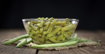 Portion of preserved Green Beans as detailed close-up shot (selective focus)