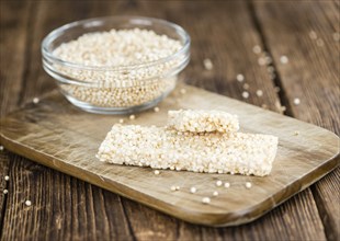 Some fresh made Quinoa Bars on vintage background (close-up shot)