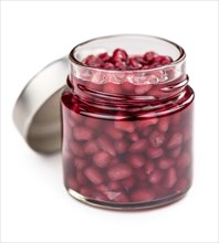 Some preserved Pomegranate seeds isolated on white (selective focus)