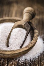 Pink Salt on a vintage background as detailed close-up shot (selective focus)