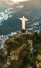 Cristo Redentor statue in Rio de Janeiro (aerial shot made from a helicopter) during a spectacular