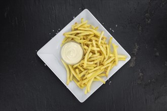 Portion of fresh made crispy French Fries (selective focus, close-up shot)